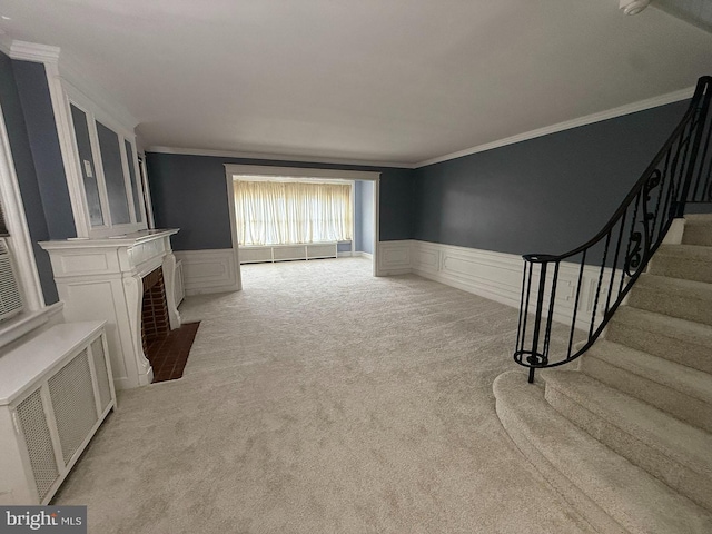 5902 E Roosevelt Blvd, Philadelphia, PA 19149 - unfurnished living room with light colored carpet, a wainscoted wall, ornamental molding, stairs, and a decorative wall