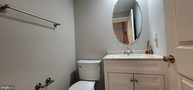 half bath featuring toilet and vanity