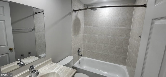 bathroom with toilet,  shower combination, and vanity