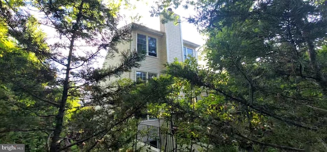 view of side of home with a chimney