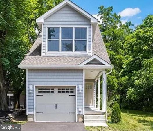 720 Kuser Rd, Hamilton, NJ 08619 - view of front facade featuring an attached garage, asphalt driveway, and roof with shingles