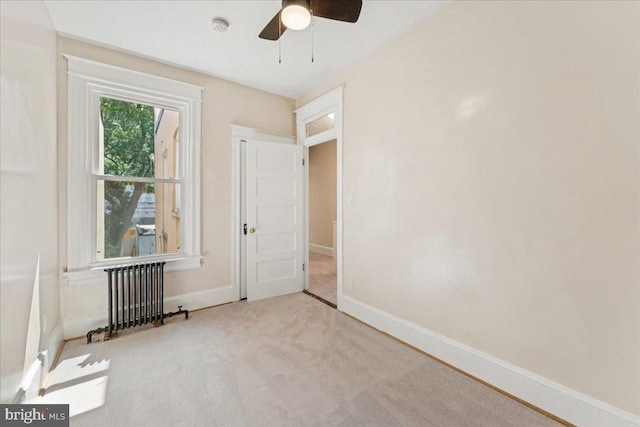 728 13th St SE, Washington, DC 20003 - carpeted empty room with radiator heating unit, ceiling fan, and a smoke detector