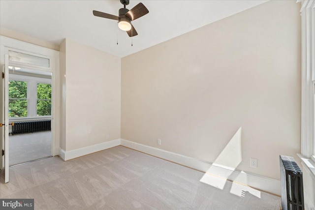 728 13th St SE, Washington, DC 20003 - empty room with carpet floors, radiator, and ceiling fan