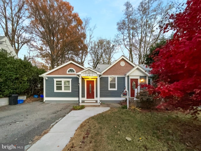 10811 Pearson St, Kensington, MD 20895 - view of front of home featuring asphalt driveway and a front yard