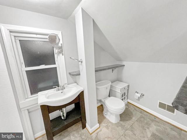 10811 Pearson St, Kensington, MD 20895 - bathroom featuring toilet, vaulted ceiling, and baseboards