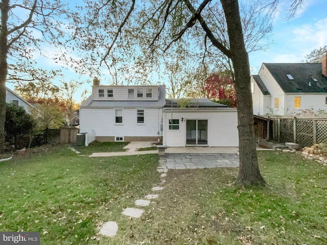 10811 Pearson St, Kensington, MD 20895 - back of house featuring solar panels, a patio, central AC unit, and a chimney