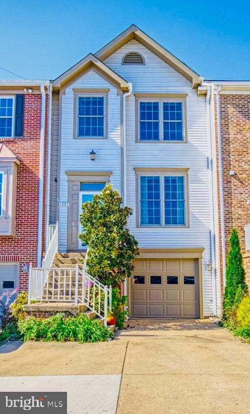 1205 Bond St, Herndon, VA 20170 - view of property with an attached garage and driveway
