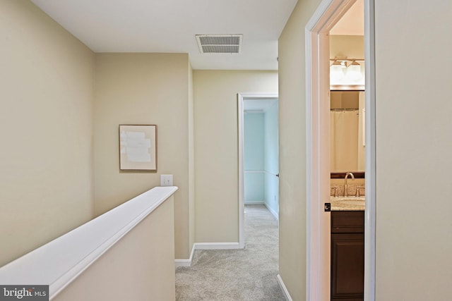 1205 Bond St, Herndon, VA 20170 - corridor with a sink and light carpet