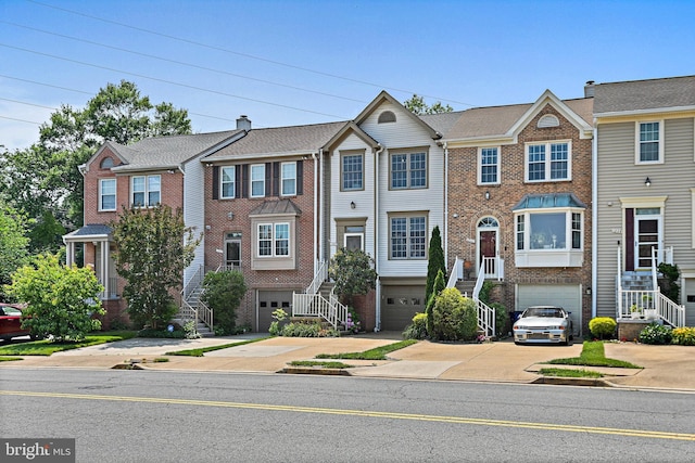 1205 Bond St, Herndon, VA 20170 - view of property featuring stairway, driveway, and brick siding