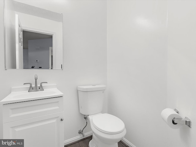 632 Island Creek Ct, Annapolis, MD 21401 - bathroom with toilet, vanity, baseboards, and wood finished floors
