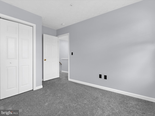 632 Island Creek Ct, Annapolis, MD 21401 - unfurnished bedroom with dark carpet, baseboards, and a closet