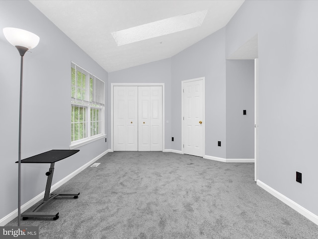 632 Island Creek Ct, Annapolis, MD 21401 - unfurnished bedroom with a skylight, vaulted ceiling, carpet, baseboards, and a closet