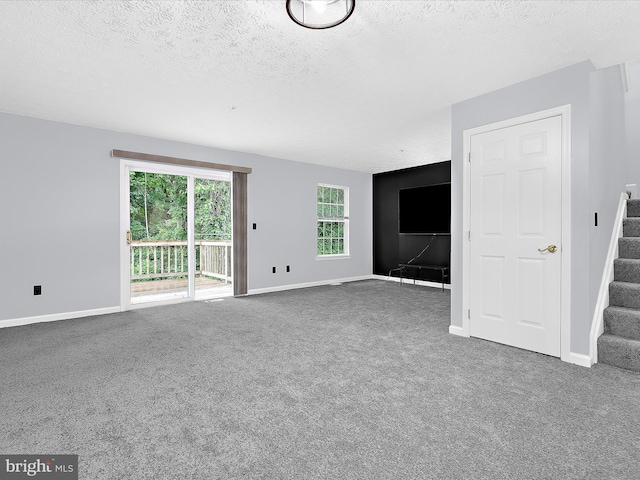 632 Island Creek Ct, Annapolis, MD 21401 - unfurnished living room featuring stairway, carpet flooring, a textured ceiling, and baseboards