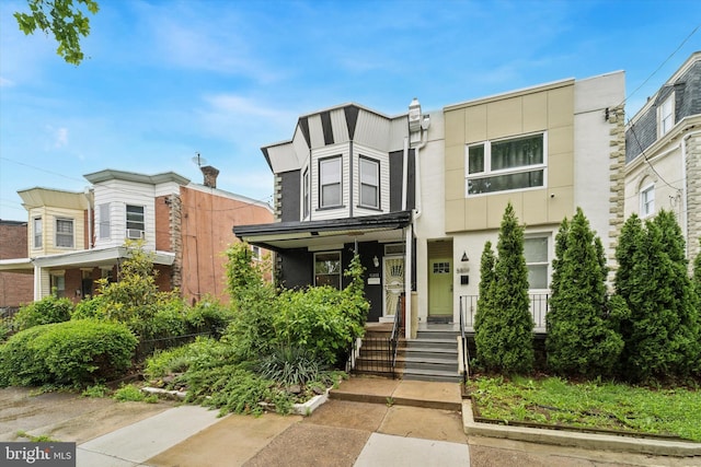 5811 Mcmahon St, Philadelphia, PA 19144 - view of front facade featuring stucco siding and covered porch