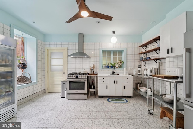 5811 Mcmahon St, Philadelphia, PA 19144 - kitchen featuring gas stove, wall chimney range hood, a sink, white cabinets, and open shelves