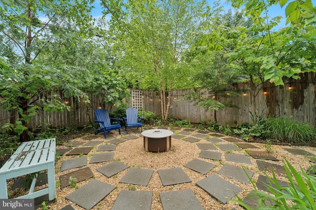 5811 Mcmahon St, Philadelphia, PA 19144 - fenced backyard with an outdoor fire pit and a patio area