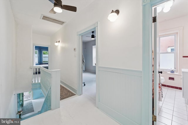 5811 Mcmahon St, Philadelphia, PA 19144 - corridor with an upstairs landing, wainscoting, and plenty of natural light