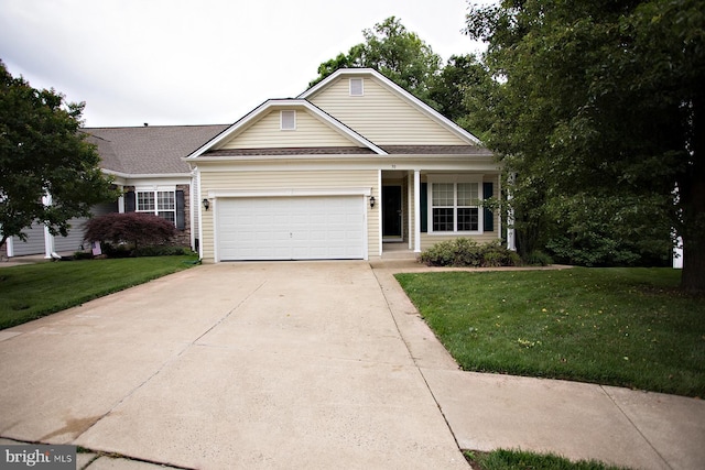 30 Dayton Cir, Fredericksburg, VA 22406 - traditional-style home featuring a front yard, driveway, an attached garage, and roof with shingles
