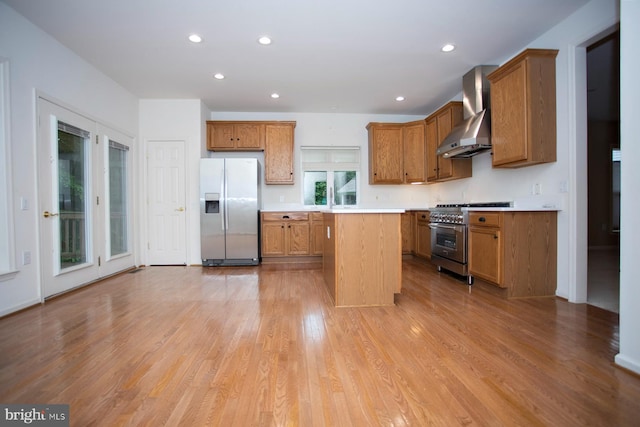 30 Dayton Cir, Fredericksburg, VA 22406 - kitchen with stainless steel appliances, wall chimney range hood, light countertops, a center island, and brown cabinetry