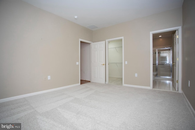 30 Dayton Cir, Fredericksburg, VA 22406 - unfurnished bedroom with a walk in closet, carpet floors, a closet, and baseboards