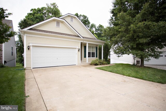 30 Dayton Cir, Fredericksburg, VA 22406 - view of front of house with a front lawn, concrete driveway, and a garage