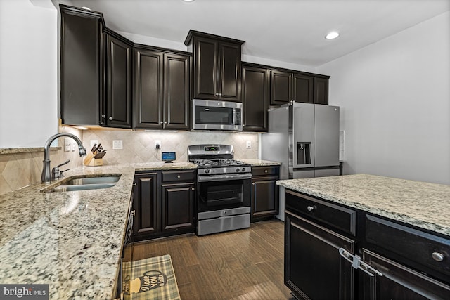 3615 Amber Way, Aberdeen, MD 21001 - kitchen with stainless steel appliances, a sink, dark cabinets, decorative backsplash, and recessed lighting