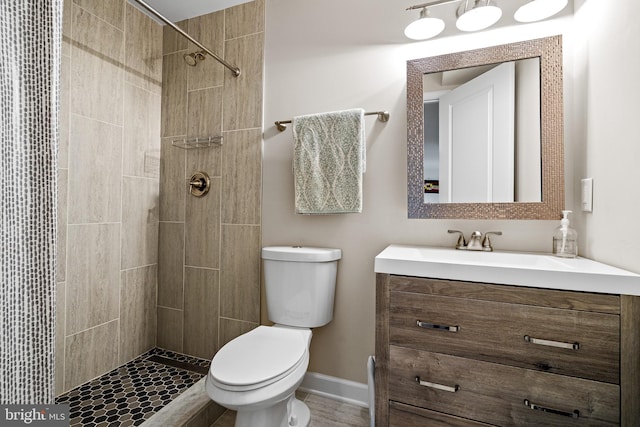 3615 Amber Way, Aberdeen, MD 21001 - bathroom featuring toilet, vanity, a tile shower, and baseboards
