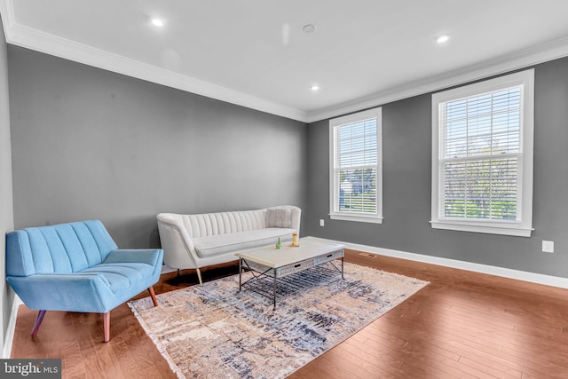 sitting room featuring crown molding, hardwood / wood-style flooring, baseboards, and recessed lighting