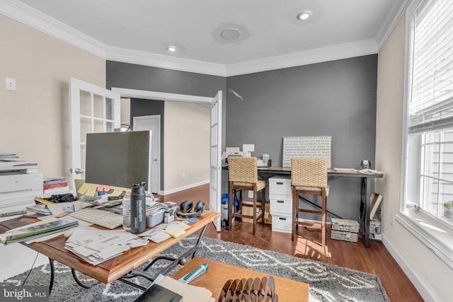 office featuring ornamental molding, baseboards, and wood finished floors