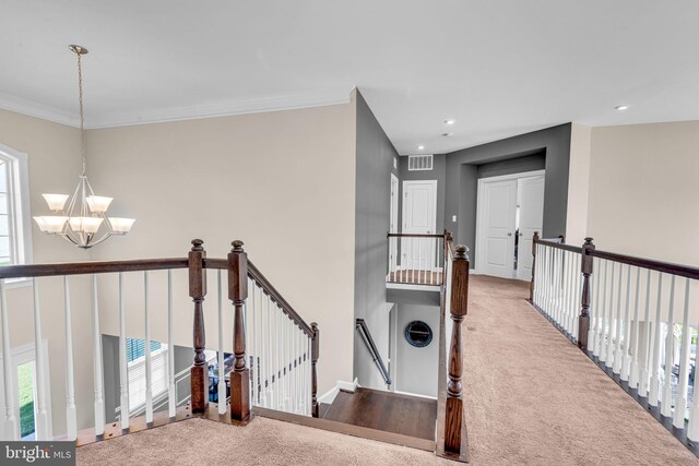 hallway featuring an upstairs landing, a chandelier, carpet, plenty of natural light, and recessed lighting