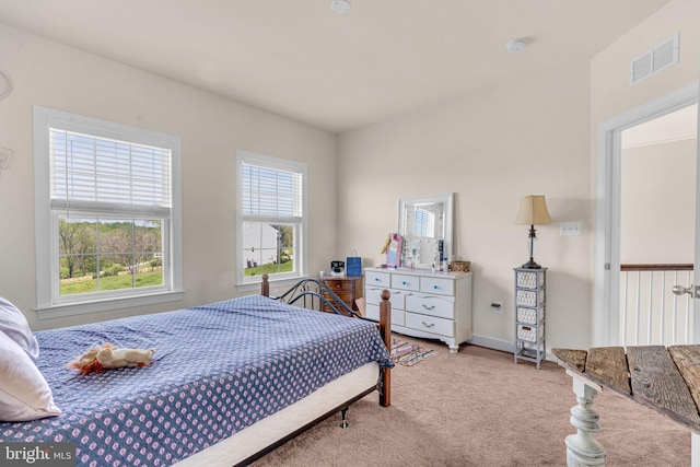 bedroom featuring carpet and baseboards