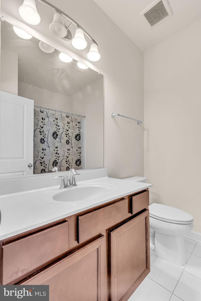 full bathroom with vanity, toilet, tile patterned floors, and a shower with curtain