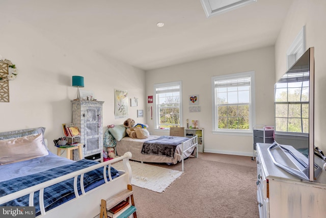 bedroom featuring carpet flooring and baseboards