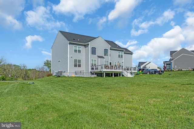 back of house featuring a lawn and cooling unit