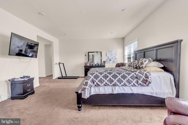 bedroom featuring carpet floors and baseboards