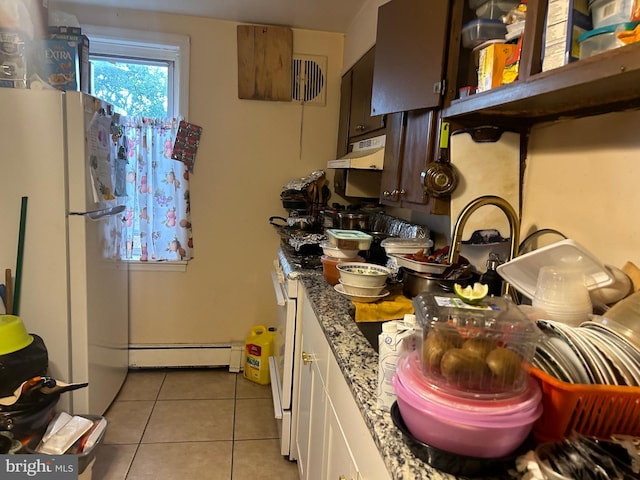 1110 Hamilton Ave, Trenton, NJ 08629 - kitchen featuring light tile patterned floors, a baseboard heating unit, under cabinet range hood, light stone counters, and white appliances
