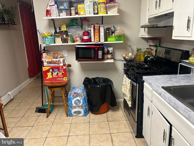 1110 Hamilton Ave, Trenton, NJ 08629 - kitchen with under cabinet range hood, gas range, a baseboard heating unit, white cabinets, and light countertops