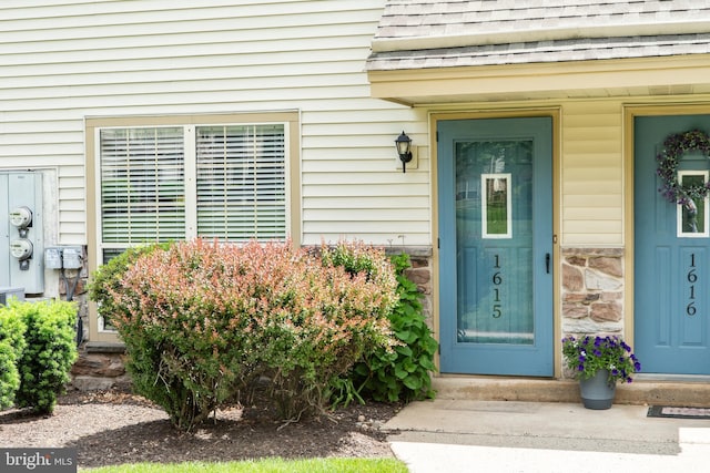 1615 Foxmeadow Cir Unit 1615, Royersford, PA 19468 - doorway to property with roof with shingles