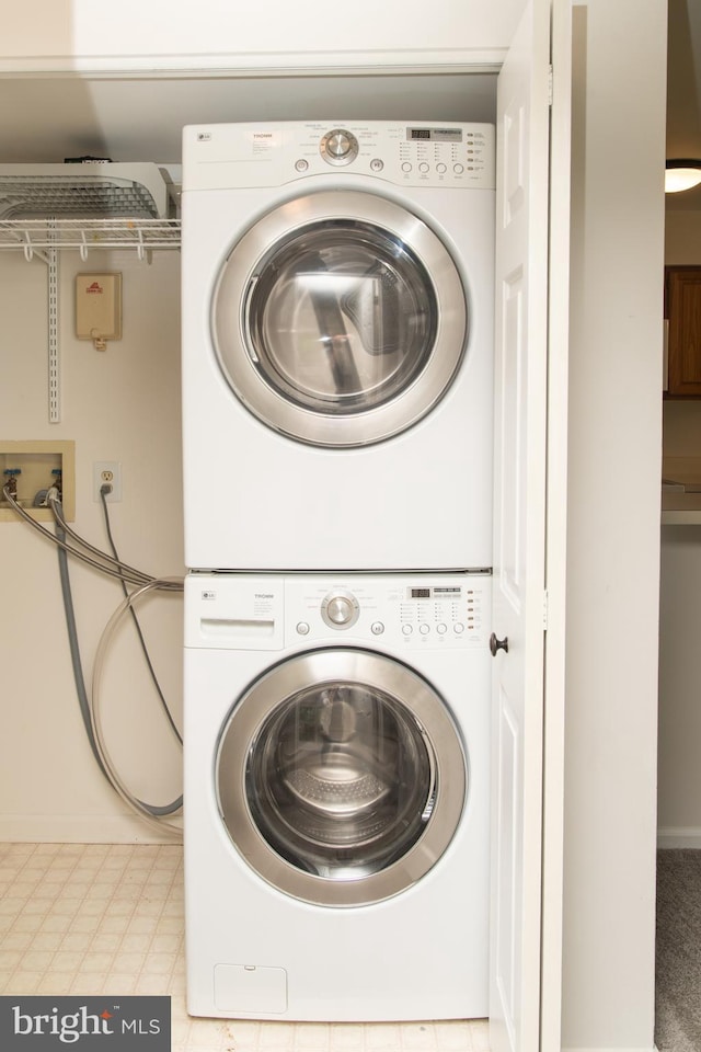 1615 Foxmeadow Cir Unit 1615, Royersford, PA 19468 - laundry room with estacked washer and dryer and baseboards