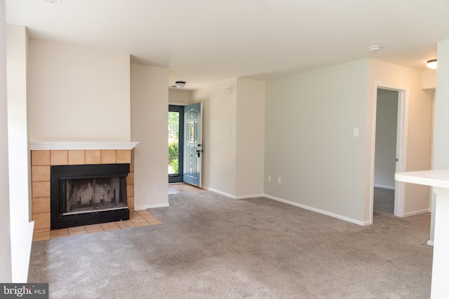 1615 Foxmeadow Cir Unit 1615, Royersford, PA 19468 - unfurnished living room with light colored carpet, a tile fireplace, and baseboards