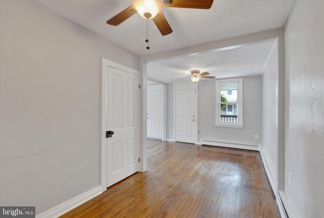137 S Main St, Yoe, PA 17313 - spare room featuring baseboard heating, ceiling fan, wood finished floors, a baseboard heating unit, and baseboards