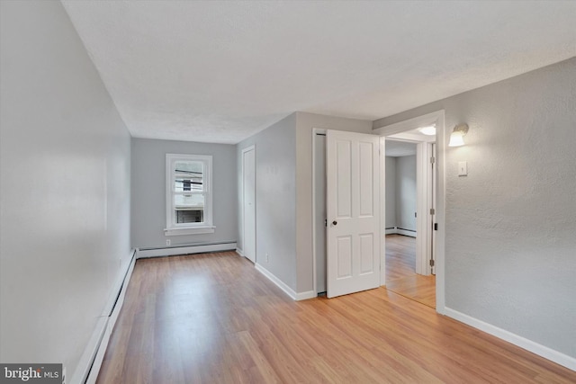 137 S Main St, Yoe, PA 17313 - unfurnished room with baseboard heating, light wood finished floors, and baseboards