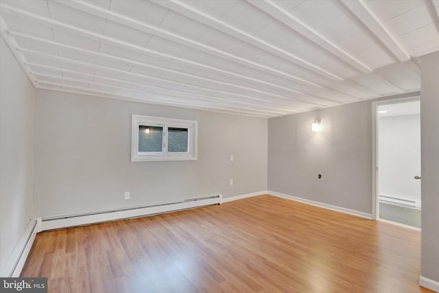 137 S Main St, Yoe, PA 17313 - empty room with a baseboard heating unit, wood finished floors, a baseboard radiator, and baseboards