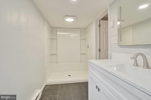 137 S Main St, Yoe, PA 17313 - bathroom with vanity, a stall shower, and baseboards