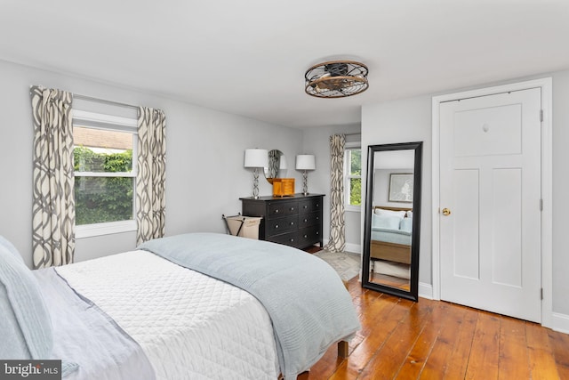 163 2nd St, Bordentown, NJ 08505 - bedroom with hardwood / wood-style floors, multiple windows, and baseboards