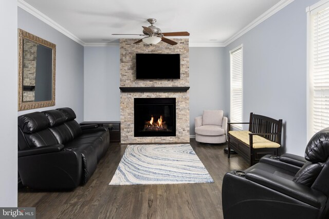 1781 Cobblestone Ln, Vineland, NJ 08361 - living room with wood finished floors, a ceiling fan, a stone fireplace, healthy amount of natural light, and crown molding