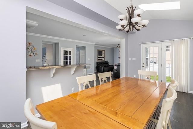 1781 Cobblestone Ln, Vineland, NJ 08361 - dining room with a chandelier, dark wood-type flooring, lofted ceiling, a skylight, and crown molding