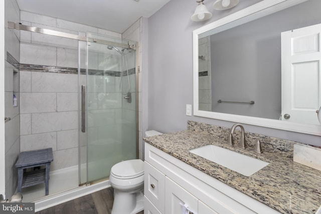 1781 Cobblestone Ln, Vineland, NJ 08361 - full bath with vanity, toilet, a shower stall, and wood finished floors