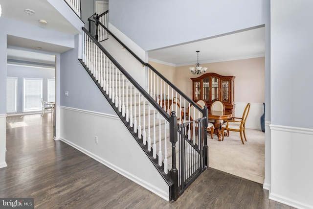 1781 Cobblestone Ln, Vineland, NJ 08361 - stairway with a chandelier, wood finished floors, ornamental molding, and baseboards