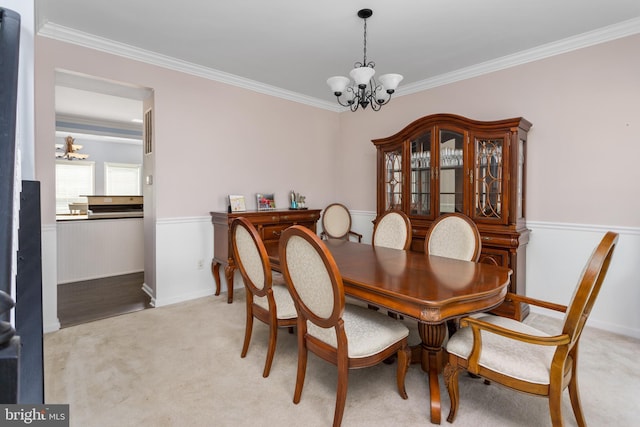 1781 Cobblestone Ln, Vineland, NJ 08361 - dining room with a chandelier, ornamental molding, a wainscoted wall, and light carpet